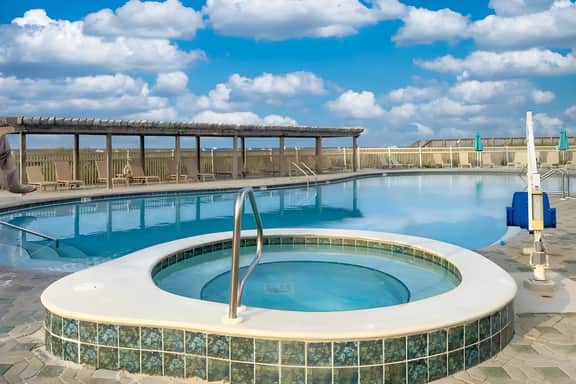 Jetty East | Sleeps 4 | Paradise Palms | Pool | Private Beach